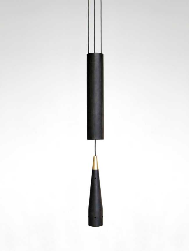 A balance between game and technology: a light in motion with the Trio wooden lamp