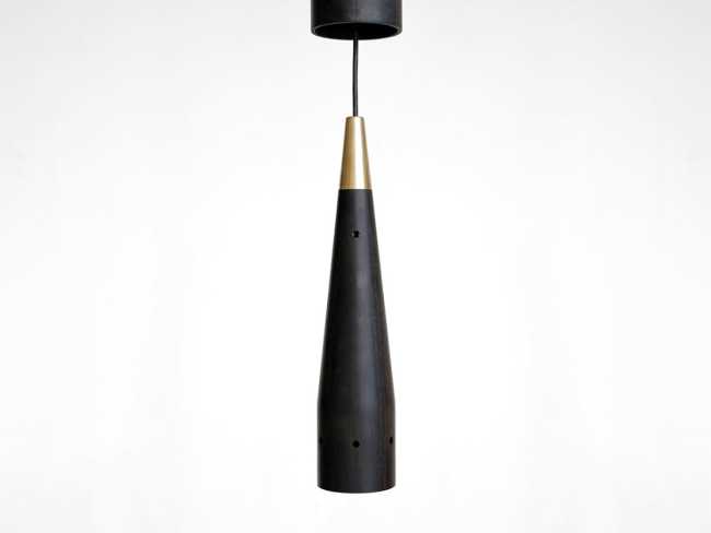 A balance between game and technology: a light in motion with the Trio wooden lamp