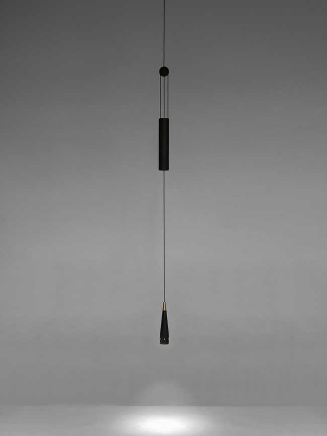 A balance between game and technology: a light in motion with the Trio wooden lamp