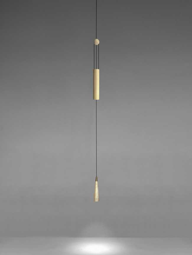 A balance between game and technology: a light in motion with the Trio wooden lamp