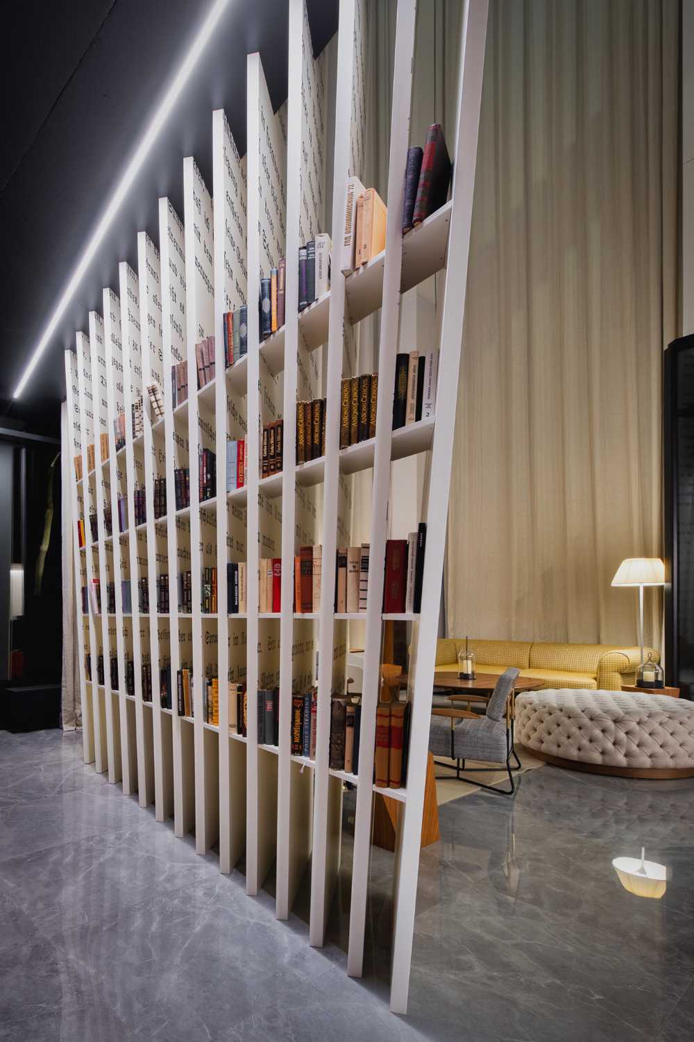 Huge wooden books create the space for the Lobby of the Philosophers Residence in Latvia