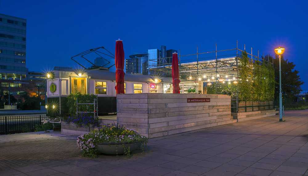 The Amsterdamsche Tram, from the repurposing of recycled materials, is transformed into a picturesque and unconventional new urban point of interest in Amsterdam