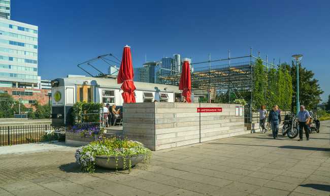 The Amsterdamsche Tram, from the repurposing of recycled materials, is transformed into a picturesque and unconventional new urban point of interest in Amsterdam