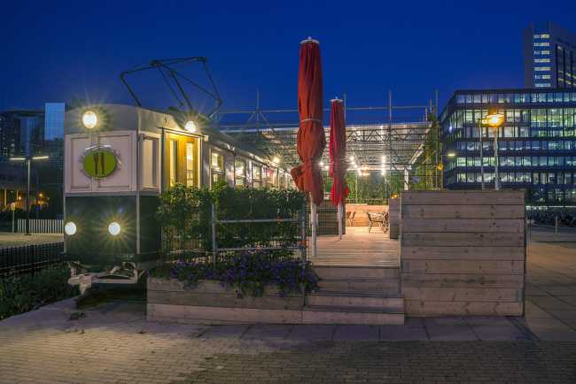 The Amsterdamsche Tram, from the repurposing of recycled materials, is transformed into a picturesque and unconventional new urban point of interest in Amsterdam