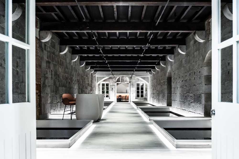 XAPO, a cryptocurrency bank in an abandoned army barracks. An architecture between history and the digital age