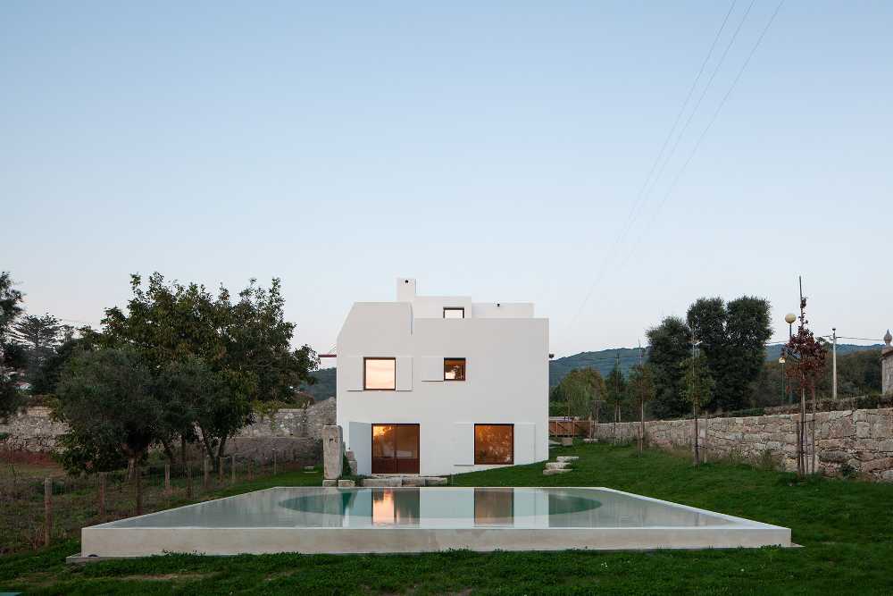 House in Afife. Minimalist architecture designed to nestle into the natural curves of the terrain.