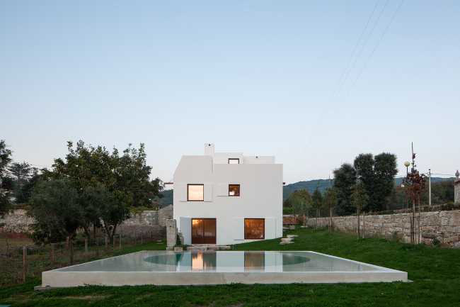 House in Afife. Minimalist architecture designed to nestle into the natural curves of the terrain.