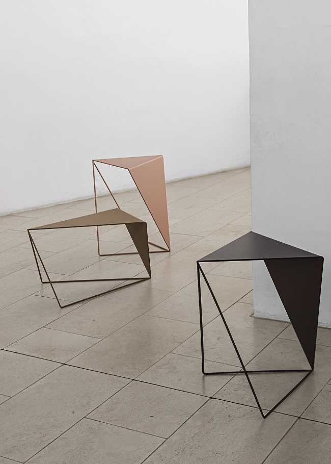 Inverse coffee tables, sculptural figures and simple geometrical designs to add personality to the environment
