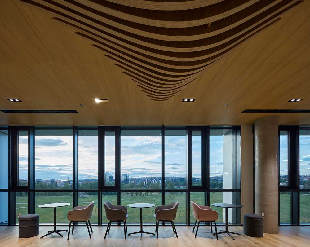 The facade of the new J&T corporate headquarters reflects the abstract painting which combines rationality, technology and irregularity