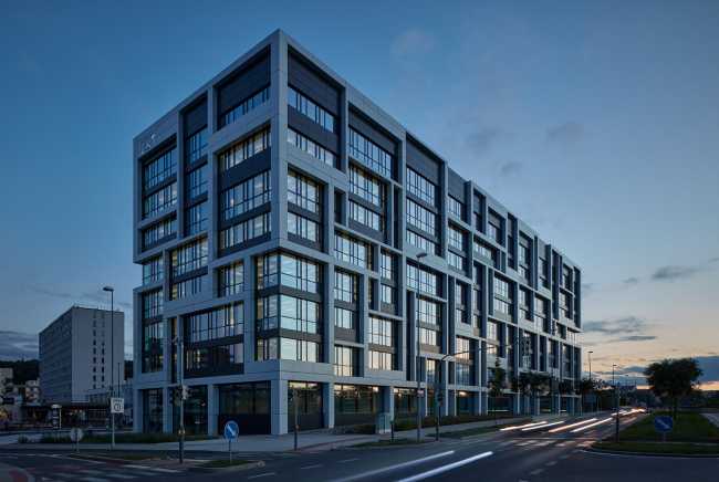 The facade of the new J&T corporate headquarters reflects the abstract painting which combines rationality, technology and irregularity