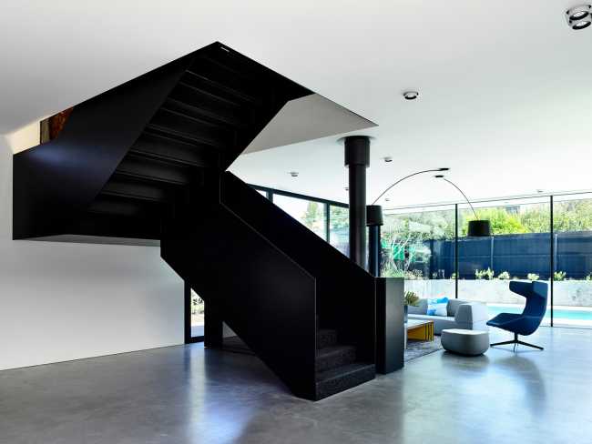 Pure materiality and clean aesthetics for a sculptural home that never forgets to