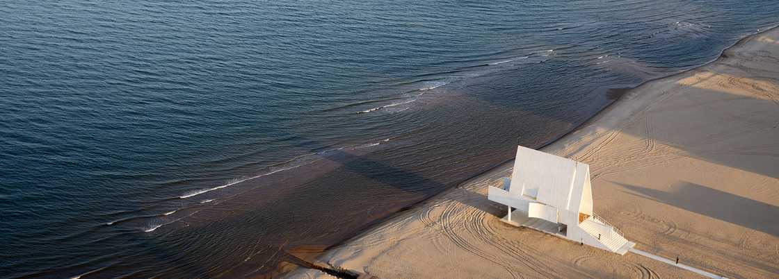 Seashore Chapel as a century-old gift from the ocean lying on the beach