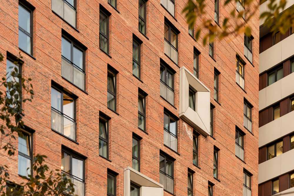 Red bricks and an interplay of openings for the new KAMPUS district