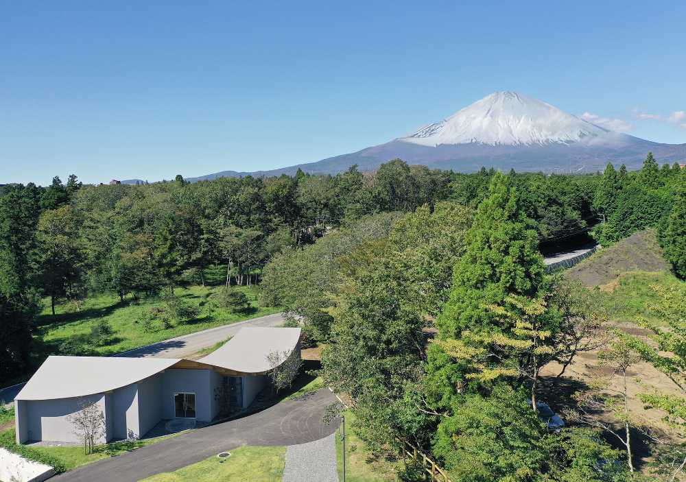The hotel nestled at the foot of the hill which runs toward Mount Fuji