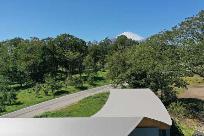 The hotel nestled at the foot of the hill which runs toward Mount Fuji