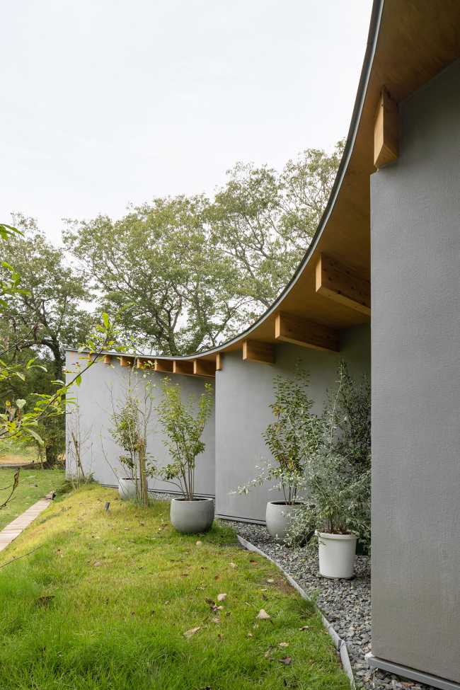 The hotel nestled at the foot of the hill which runs toward Mount Fuji