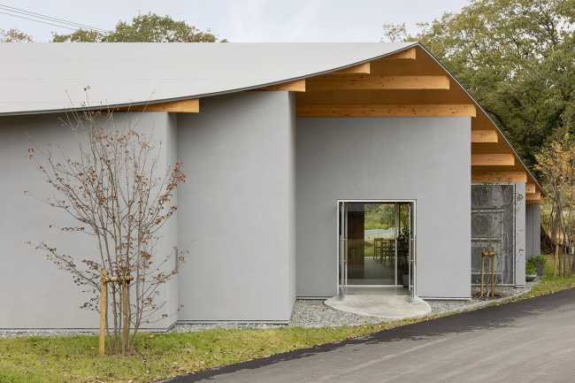 The hotel nestled at the foot of the hill which runs toward Mount Fuji