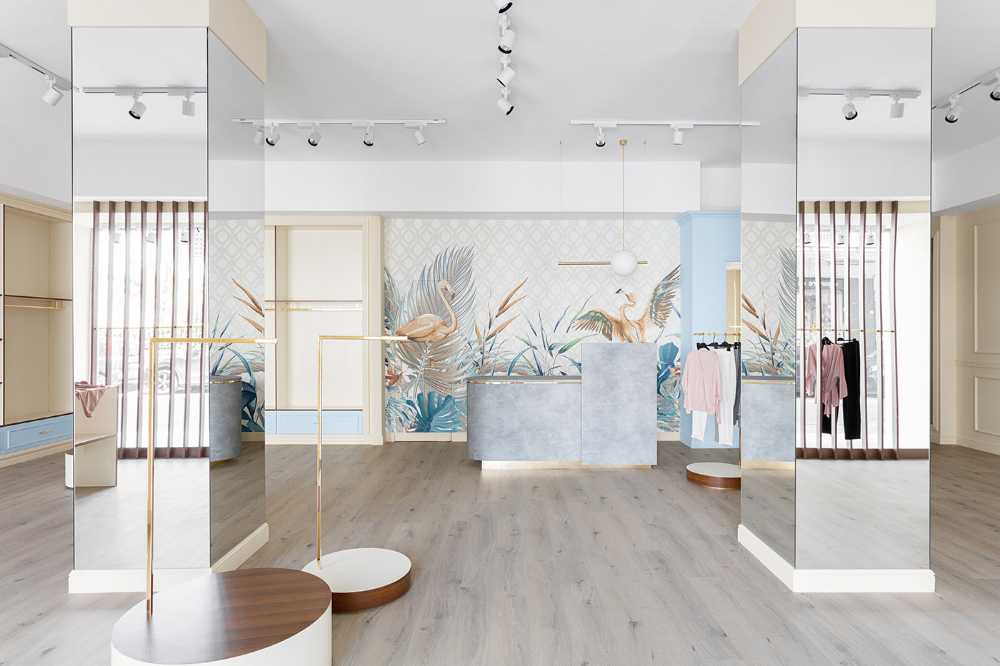 1960s revival for Reve Store design: fashion store dressed in wood, gold and pastel colors