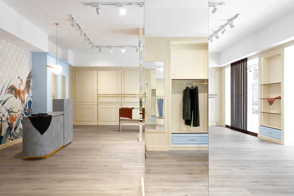 1960s revival for Reve Store design: fashion store dressed in wood, gold and pastel colors