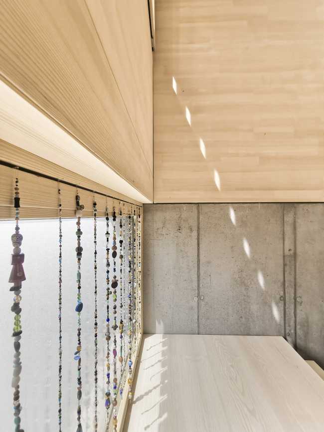 House W1T in legno e cemento per un abitare sostenibile e un’architettura dai volumi dinamici