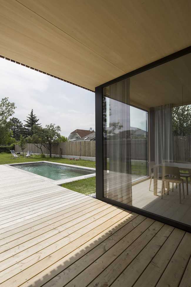 House W1T in legno e cemento per un abitare sostenibile e un’architettura dai volumi dinamici