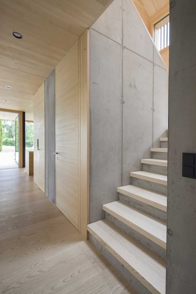 House W1T in legno e cemento per un abitare sostenibile e un’architettura dai volumi dinamici