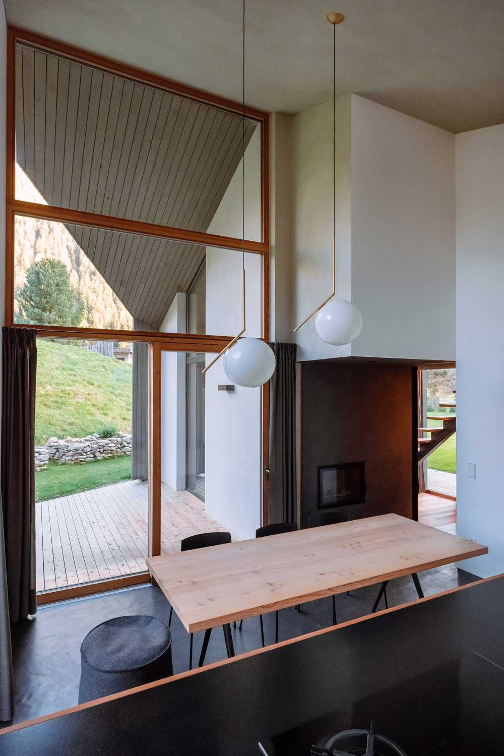 Wood cladding and blackened steel details featured in House L in an effort to integrate the architecture into a protected natural area