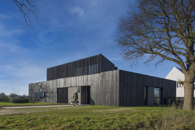 Burnt wood and an energetic neutrality in the silky Dutch Black House