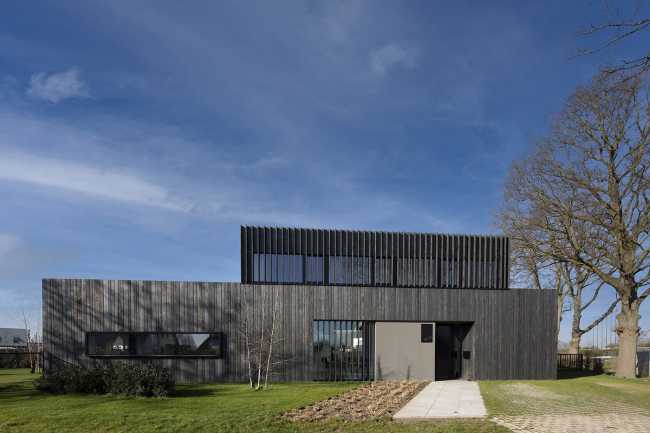 Burnt wood and an energetic neutrality in the silky Dutch Black House