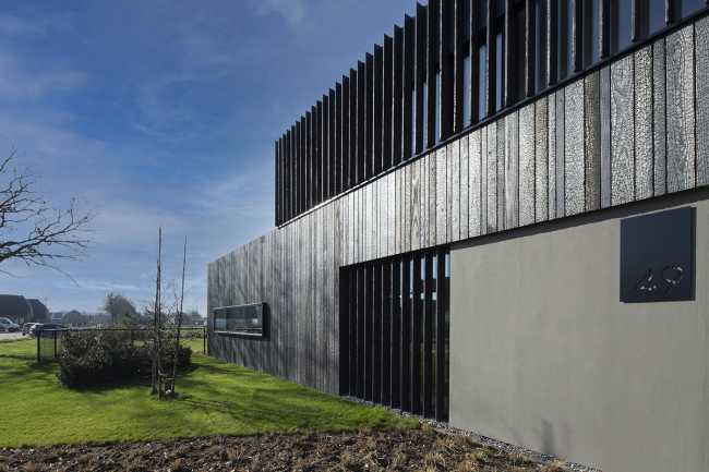 Burnt wood and an energetic neutrality in the silky Dutch Black House