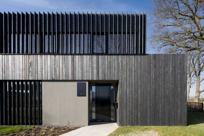 Burnt wood and an energetic neutrality in the silky Dutch Black House