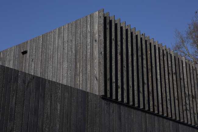 Burnt wood and an energetic neutrality in the silky Dutch Black House