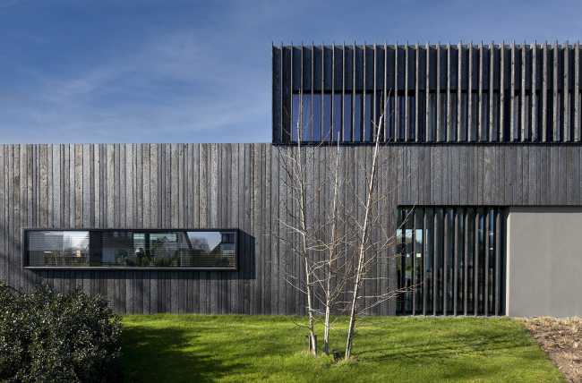 Burnt wood and an energetic neutrality in the silky Dutch Black House