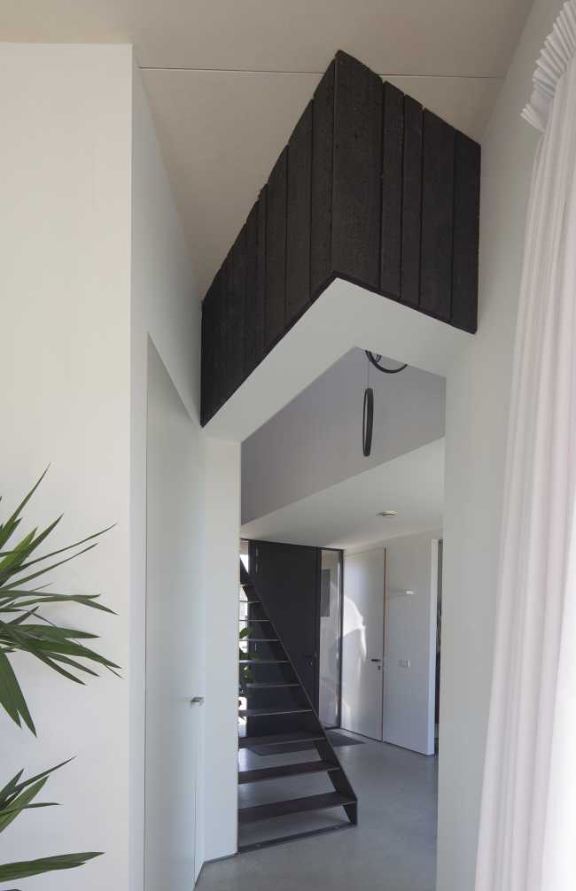 Burnt wood and an energetic neutrality in the silky Dutch Black House