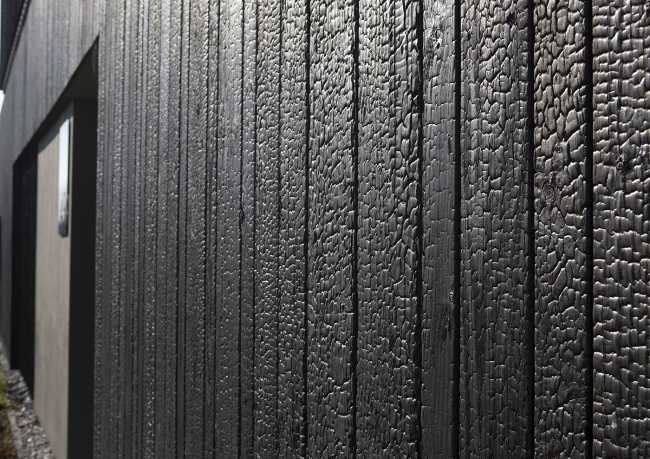 Burnt wood and an energetic neutrality in the silky Dutch Black House