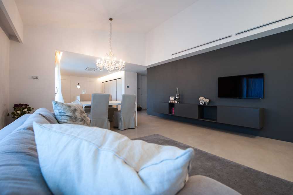Minimalist penthouse. Architecture and furniture blend together using similar materials