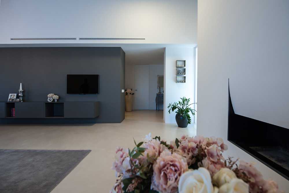Minimalist penthouse. Architecture and furniture blend together using similar materials