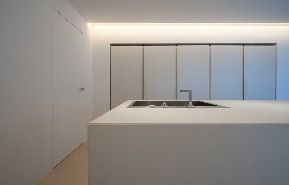 Minimalist penthouse. Architecture and furniture blend together using similar materials