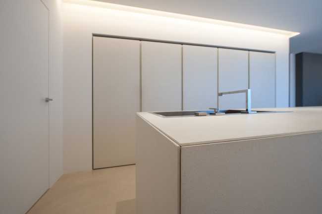 Minimalist penthouse. Architecture and furniture blend together using similar materials