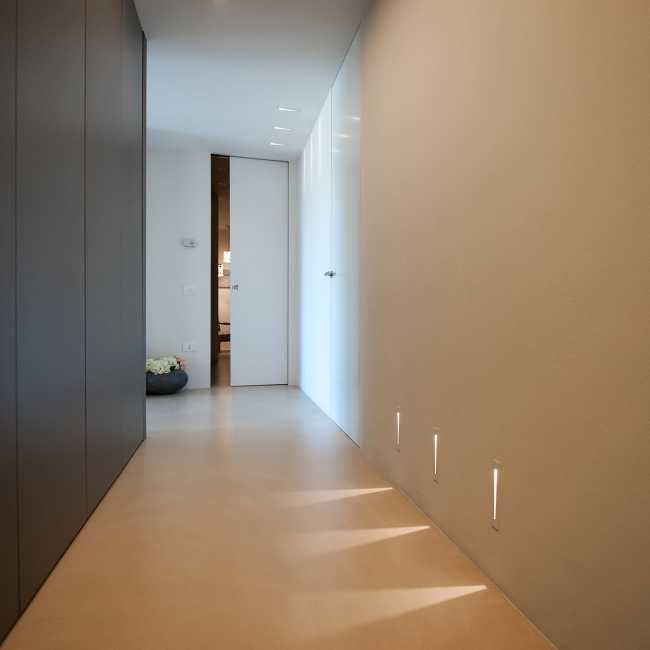 Minimalist penthouse. Architecture and furniture blend together using similar materials