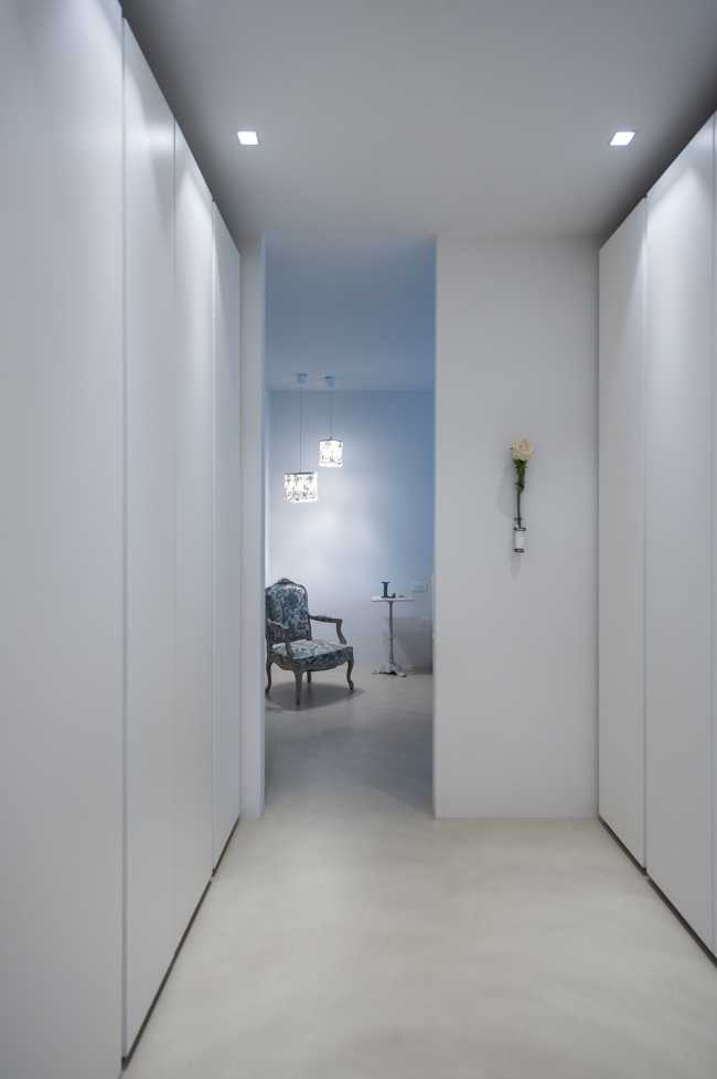 Minimalist penthouse. Architecture and furniture blend together using similar materials