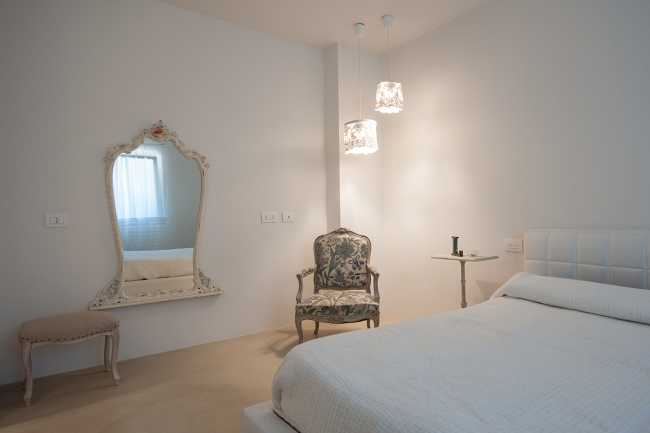 Minimalist penthouse. Architecture and furniture blend together using similar materials