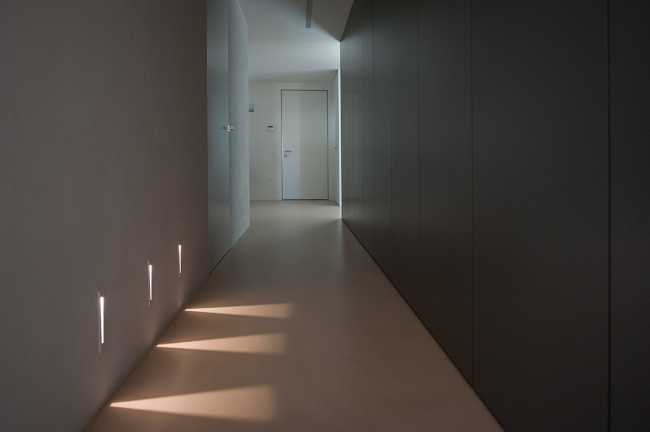 Minimalist penthouse. Architecture and furniture blend together using similar materials