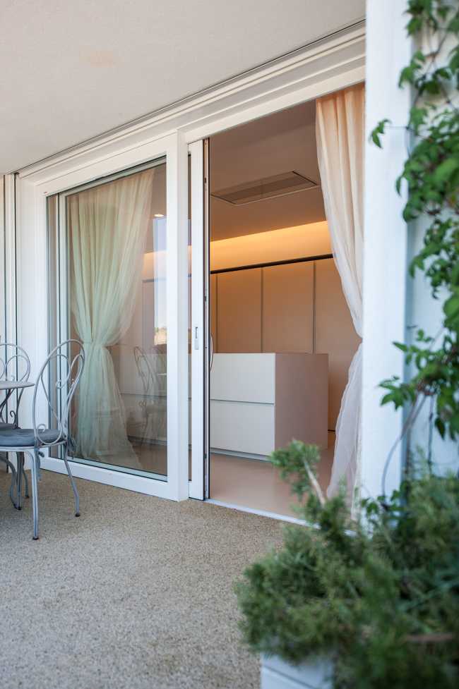 Minimalist penthouse. Architecture and furniture blend together using similar materials