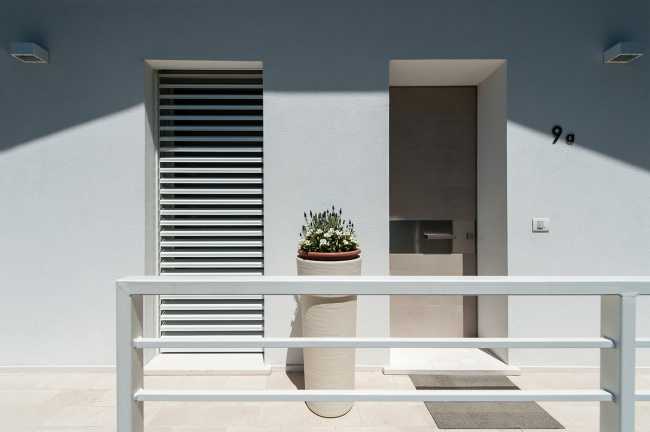 Minimalist penthouse. Architecture and furniture blend together using similar materials