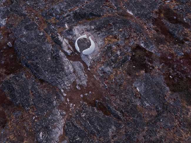A glazed brick casket that is inspired by the reflections of the moon on the snow