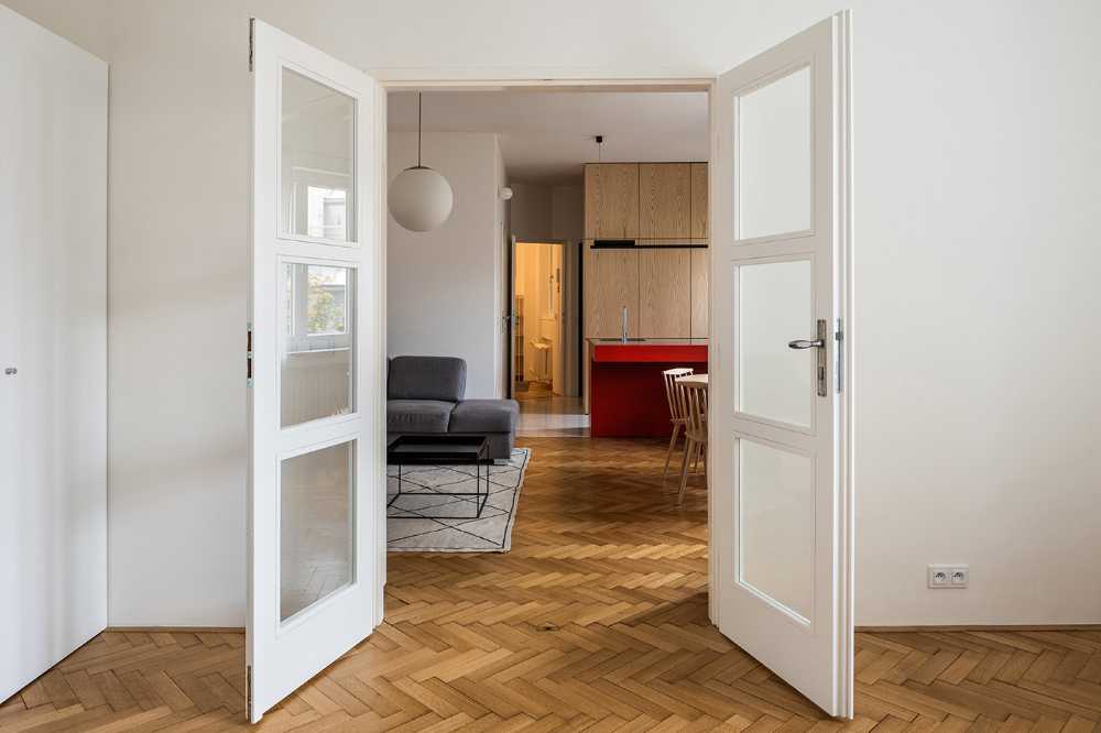 The renovation of the Apartment H in Bratislava's Old Town. A rational layout and a contrast between the white and the primary colors