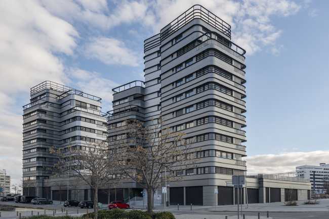 Three towers for housing and stores in Madrid. Panoramic views, social interaction and integration with nature are the highlights of the project