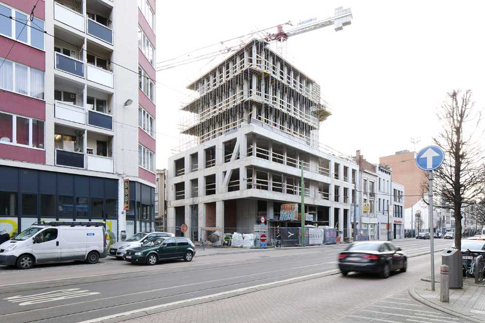 Zegel a mixed-function building with an exuberant structure toned down by the lightweight aluminum façade shell
