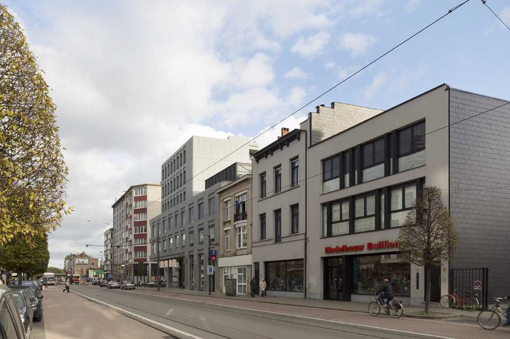 Zegel a mixed-function building with an exuberant structure toned down by the lightweight aluminum façade shell